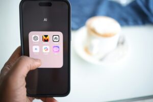 a person holding a cell phone in their hand AI Overviews